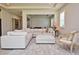 Open living room with sectional sofa, ottoman, and view to dining area at 4326 Silo Port Ct, Lakewood Ranch, FL 34211