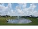 Community pond with fountain and lush landscaping at 4326 Silo Port Ct, Lakewood Ranch, FL 34211