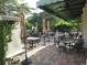 Outdoor patio seating area with umbrellas and tables at 445 N Orange Ave # 209, Sarasota, FL 34236