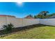 Simple backyard with white fence and small plants at 4581 E Dover Street Cir, Bradenton, FL 34203