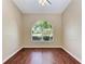Bright bedroom with wood floors and large arched window at 4581 E Dover Street Cir, Bradenton, FL 34203