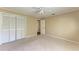 Spacious bedroom with double doors and carpet flooring at 4581 E Dover Street Cir, Bradenton, FL 34203