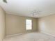 Bright bedroom with ceiling fan and carpet flooring at 4581 E Dover Street Cir, Bradenton, FL 34203