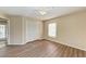 Bedroom with double door closet and wood-look flooring at 4581 E Dover Street Cir, Bradenton, FL 34203