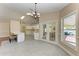 Open dining area with view of kitchen and access to backyard at 4581 E Dover Street Cir, Bradenton, FL 34203