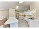 Kitchen with white cabinets, tile floor and breakfast bar at 4581 E Dover Street Cir, Bradenton, FL 34203