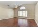 Spacious living room featuring wood floors and an arched window at 4581 E Dover Street Cir, Bradenton, FL 34203