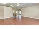 Open living room and kitchen with wood floors and breakfast bar at 4581 E Dover Street Cir, Bradenton, FL 34203