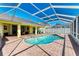 Relaxing pool area with covered patio and seating at 4581 E Dover Street Cir, Bradenton, FL 34203