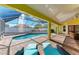 Relaxing pool and patio area with covered seating at 4581 E Dover Street Cir, Bradenton, FL 34203