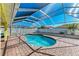 Inviting kidney-shaped pool with covered patio at 4581 E Dover Street Cir, Bradenton, FL 34203