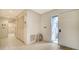 Bright foyer with tiled floor, storage closet and access to other rooms at 4781 Chandlers Forde # 5, Sarasota, FL 34235