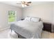 Bedroom with king-size bed and ceiling fan at 4892 Hillman Ter, North Port, FL 34288