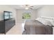Main bedroom with large bed, dresser, and backyard view at 4892 Hillman Ter, North Port, FL 34288