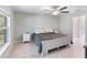 Comfortable bedroom with a ceiling fan and large window at 4892 Hillman Ter, North Port, FL 34288