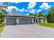 New three-car garage home with paver driveway at 4892 Hillman Ter, North Port, FL 34288