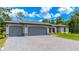 Three-car garage home with paver driveway at 4892 Hillman Ter, North Port, FL 34288