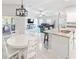 Open concept kitchen and dining area with granite countertops at 4892 Hillman Ter, North Port, FL 34288