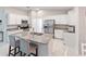 Modern kitchen with island and stainless steel appliances at 4892 Hillman Ter, North Port, FL 34288