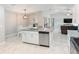 Modern kitchen with granite countertops and stainless steel appliances at 4892 Hillman Ter, North Port, FL 34288