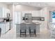 Bright kitchen with white cabinets and granite countertops at 4892 Hillman Ter, North Port, FL 34288