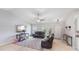 Spacious living room with leather furniture and high ceilings at 4892 Hillman Ter, North Port, FL 34288