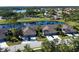 Aerial view of villa community near golf course and lake at 4936 Mahogany Run Ave, Sarasota, FL 34241