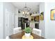 Bright dining area with a view into the kitchen at 4936 Mahogany Run Ave, Sarasota, FL 34241