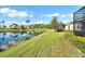 Beautiful pond view with lush landscaping at 4936 Mahogany Run Ave, Sarasota, FL 34241