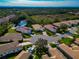 Aerial view of a residential neighborhood with houses and lush green spaces at 5086 Faberge Pl, Sarasota, FL 34233