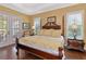 Main bedroom with king-size bed and access to backyard at 5086 Faberge Pl, Sarasota, FL 34233