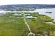Aerial view of lush mangrove preserve with walking path at 5179 Flicker Field Cir, Sarasota, FL 34231