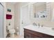Clean bathroom with a vanity, toilet and shower at 5179 Flicker Field Cir, Sarasota, FL 34231