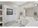 Clean bathroom with a walk-in shower and a corner vanity at 5179 Flicker Field Cir, Sarasota, FL 34231