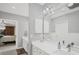 Spa-like bathroom with double vanity and a view of the bedroom at 5179 Flicker Field Cir, Sarasota, FL 34231