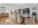 Open concept dining room with a rustic table and access to the pool at 5179 Flicker Field Cir, Sarasota, FL 34231