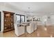Elegant dining room adjacent to the kitchen, hardwood floors at 5179 Flicker Field Cir, Sarasota, FL 34231