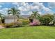 Single story home with a two car garage and manicured landscaping at 5179 Flicker Field Cir, Sarasota, FL 34231