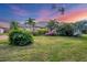 Single story home with landscaped yard, at sunset at 5179 Flicker Field Cir, Sarasota, FL 34231