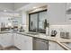 Modern kitchen featuring granite countertops and a view to the backyard at 5179 Flicker Field Cir, Sarasota, FL 34231