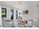 Living area with shiplap wall, comfortable seating, and natural light at 5179 Flicker Field Cir, Sarasota, FL 34231