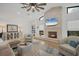 Cozy living room with a stone fireplace and large screen TV at 5179 Flicker Field Cir, Sarasota, FL 34231