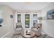 Living area with shiplap wall, comfortable seating, and natural light at 5179 Flicker Field Cir, Sarasota, FL 34231