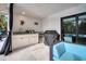Outdoor kitchen with grill, sink, and mini-fridge at 5179 Flicker Field Cir, Sarasota, FL 34231