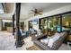 Outdoor patio furniture with seating and a view of the pool at 5179 Flicker Field Cir, Sarasota, FL 34231