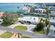 Single-story home with circular driveway and canal views in a tranquil waterfront community at 548 Ketch Ln, Longboat Key, FL 34228