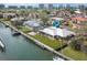 Waterfront home with private dock and lush landscaping, offering stunning water views at 548 Ketch Ln, Longboat Key, FL 34228