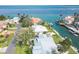 Waterfront property with private dock and lush landscaping, offering breathtaking water views at 548 Ketch Ln, Longboat Key, FL 34228