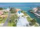 Aerial view of waterfront home with private dock and lush landscaping at 548 Ketch Ln, Longboat Key, FL 34228