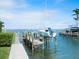 Private boat dock with sailboat lift at 548 Ketch Ln, Longboat Key, FL 34228
